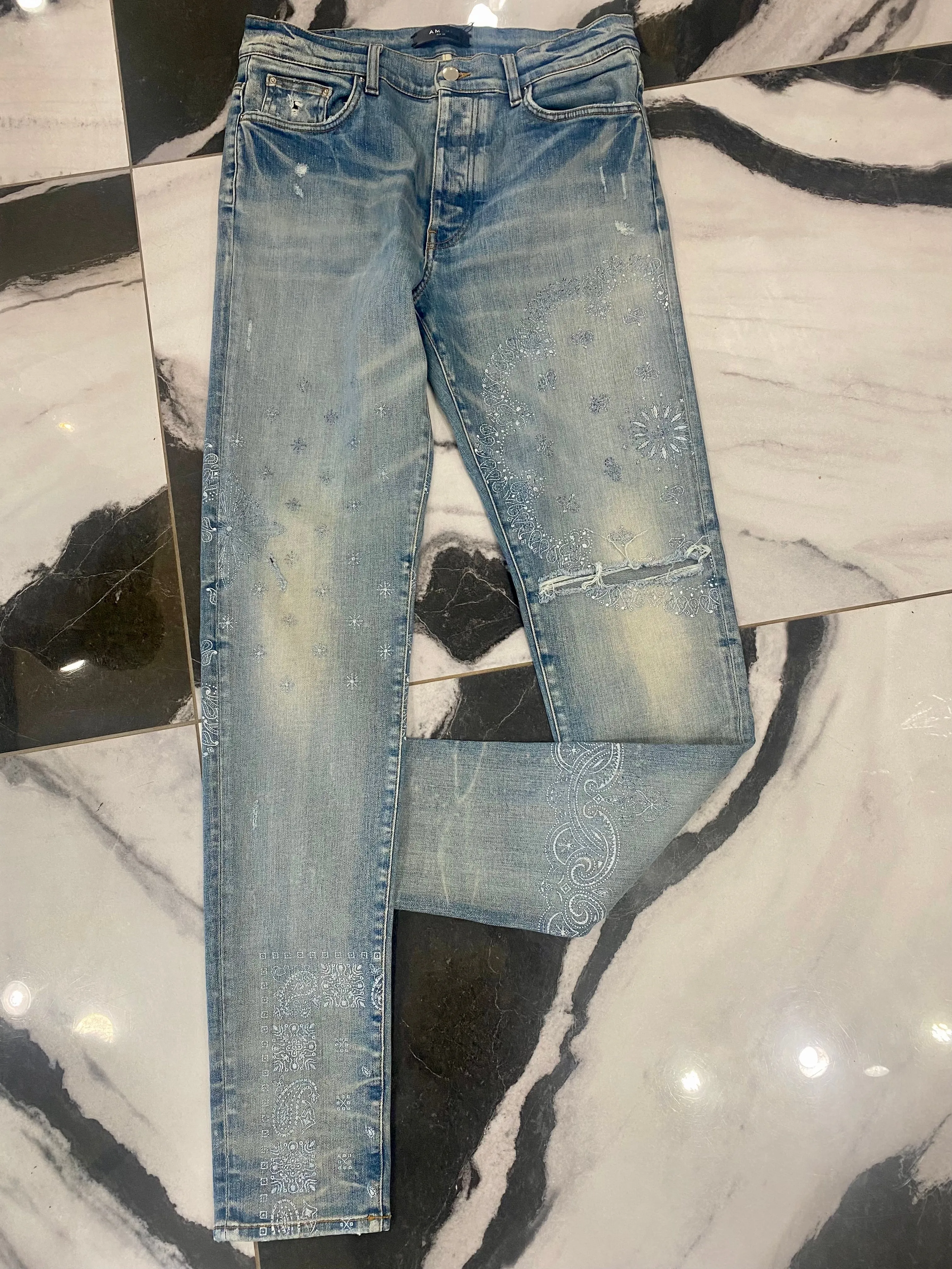 AMIRI DISTRESSED SCREEN PRINT BANDANA JEANS