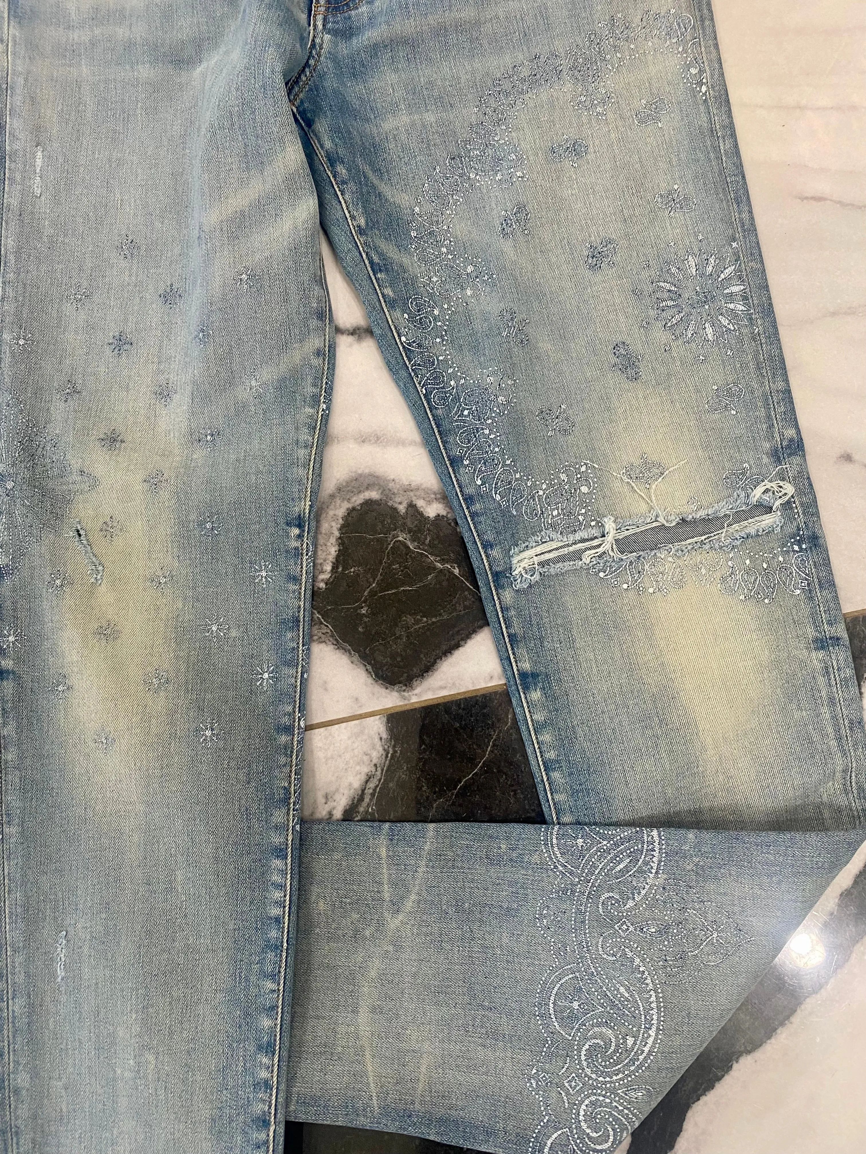 AMIRI DISTRESSED SCREEN PRINT BANDANA JEANS