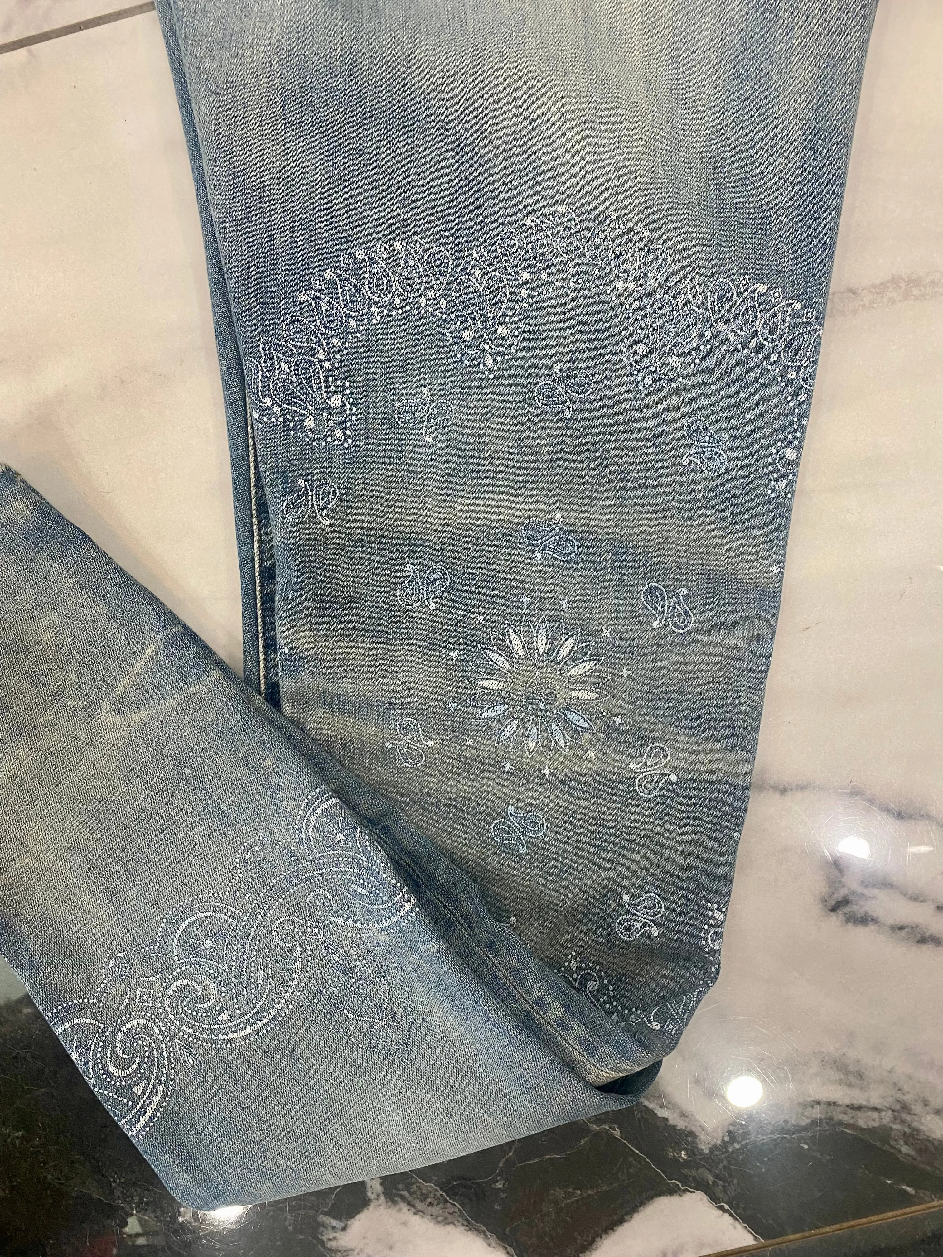 AMIRI DISTRESSED SCREEN PRINT BANDANA JEANS